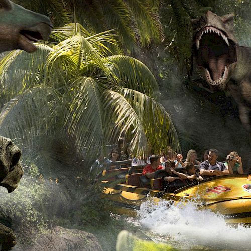 People in a yellow boat on a water ride with large animatronic dinosaurs in a jungle-themed setting, surrounded by lush vegetation.